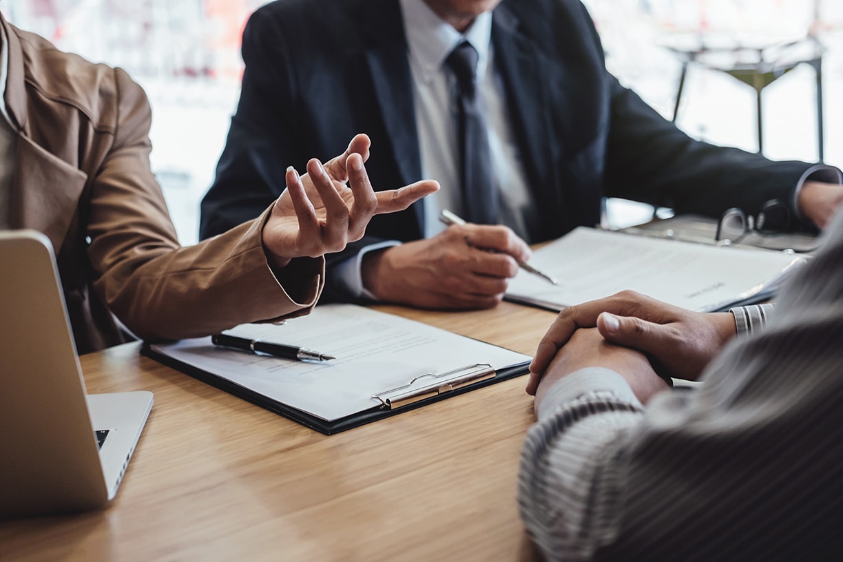 Two,Senior,Manager,Reading,A,Resume,During,A,Job,Interview, Two senior manager reading a resume during a job interview, Employer interviewing to ask young male job seeker for recruitment talking in office.