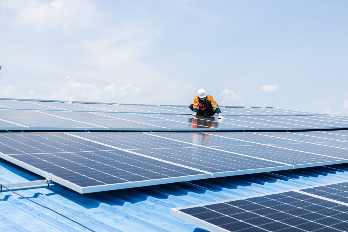 Solar panel installation. Image via Shutterstock.