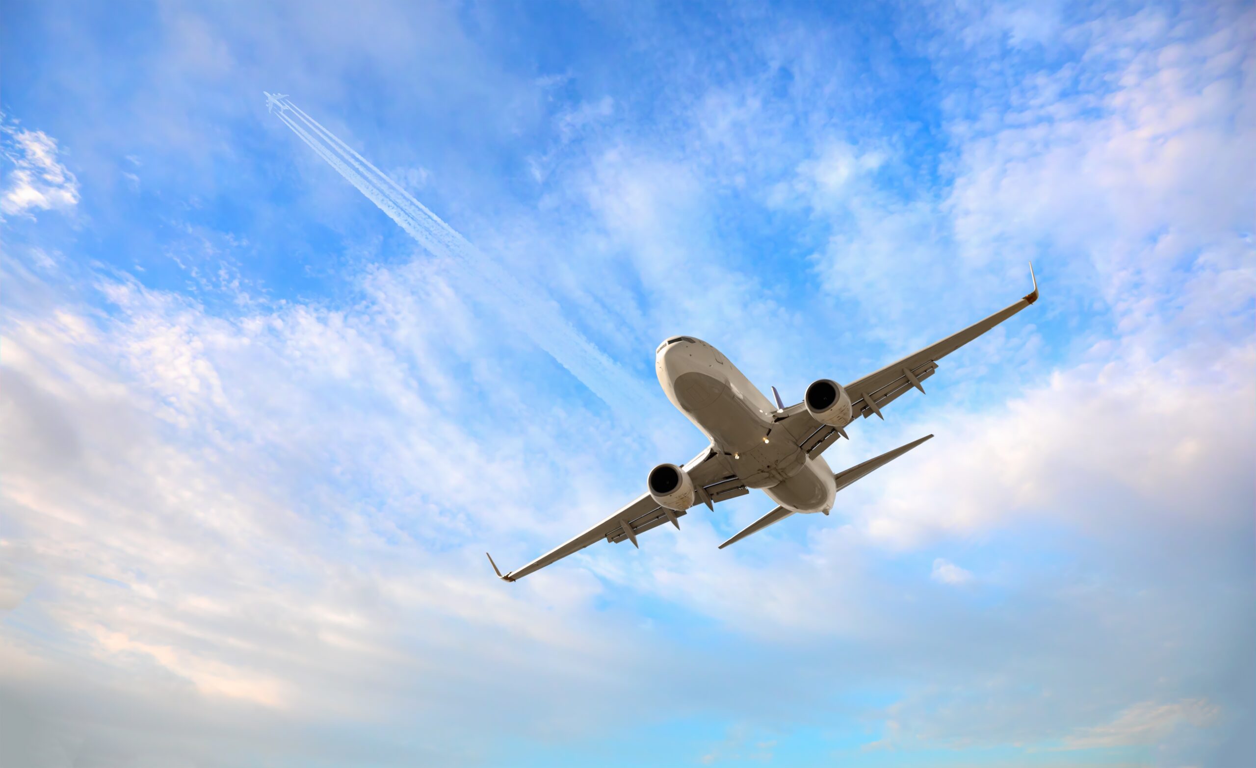 An airplane from below. Image via Shutterstock.